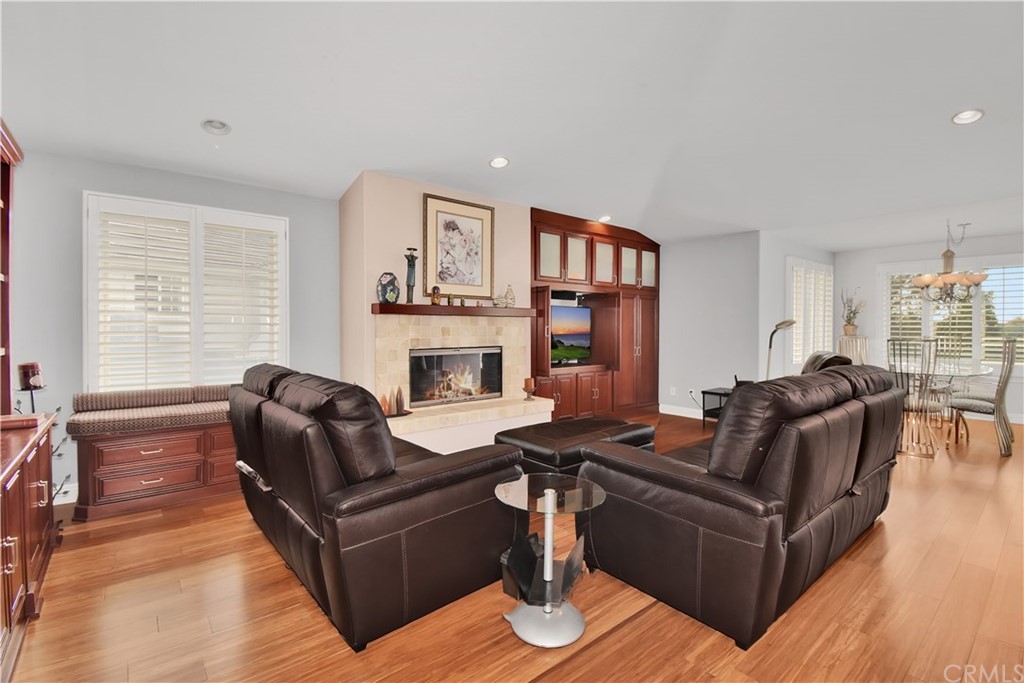 22 Hillcrest Manor Rolling Hills Estates, CA 90274 - Photo 11 of 54 a living room with furniture fireplace and a table