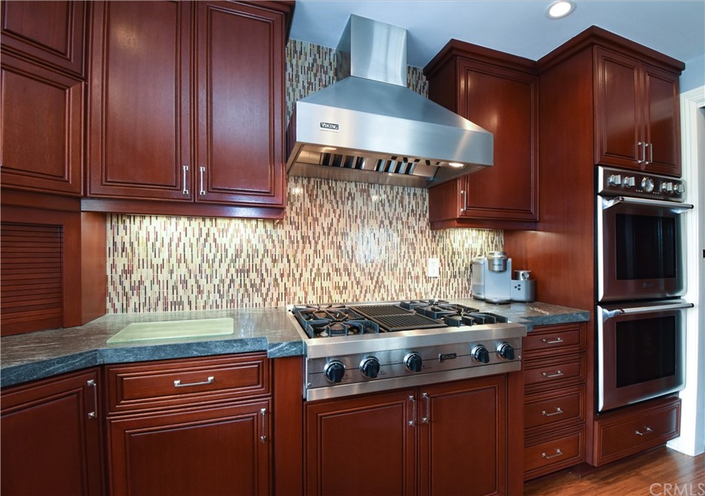 22 Hillcrest Manor Rolling Hills Estates, CA 90274 - Photo 17 of 54 a kitchen with stainless steel appliances granite countertop a stove and a microwave