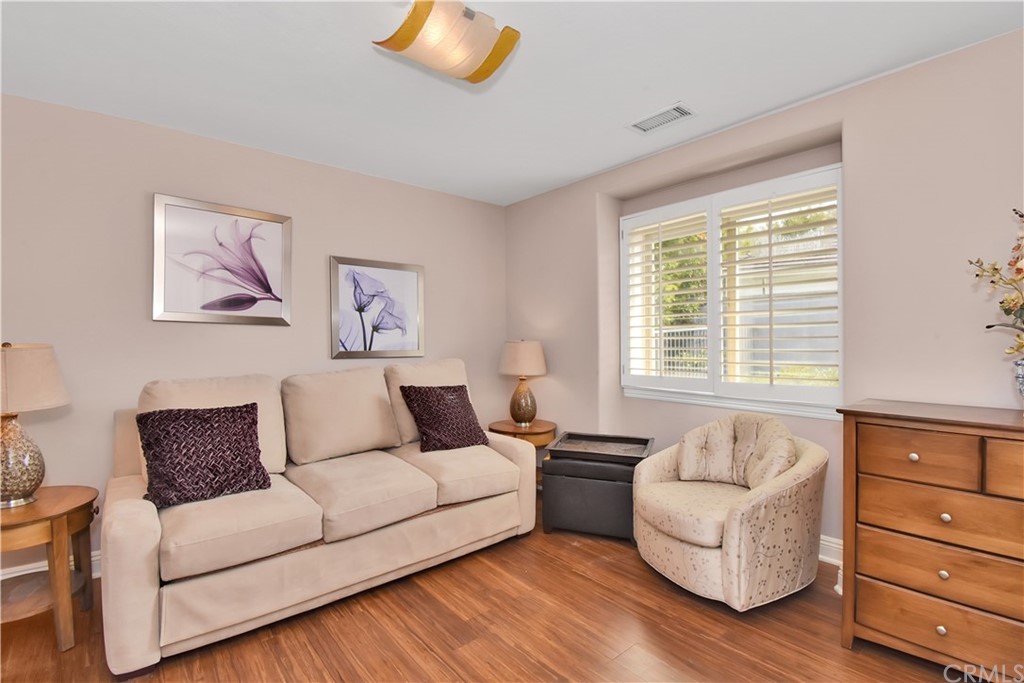 22 Hillcrest Manor Rolling Hills Estates, CA 90274 - Photo 19 of 54 a living room with furniture and a potted plant