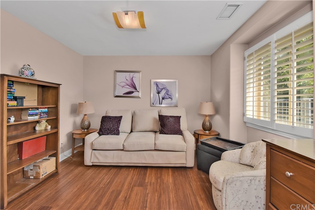 22 Hillcrest Manor Rolling Hills Estates, CA 90274 - Photo 20 of 54 a living room with furniture and a flat screen tv