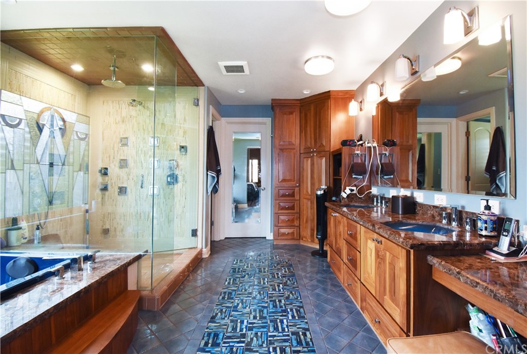 22 Hillcrest Manor Rolling Hills Estates, CA 90274 - Photo 26 of 54 a large bathroom with a double vanity sink and a large mirror