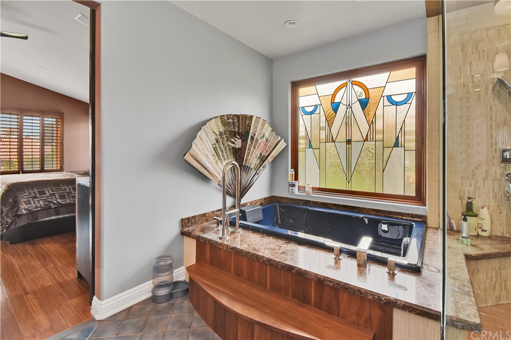 22 Hillcrest Manor Rolling Hills Estates, CA 90274 - Photo 28 of 54 a room with a large window and bed