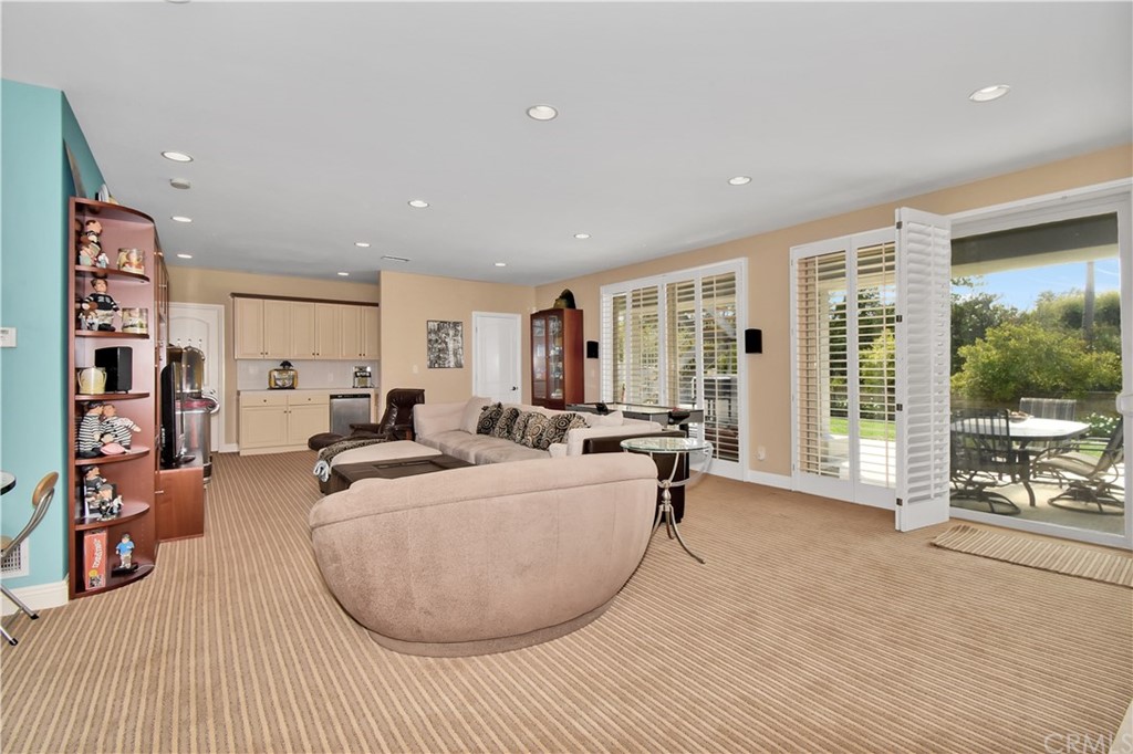 22 Hillcrest Manor Rolling Hills Estates, CA 90274 - Photo 31 of 54 a living room with furniture and large windows