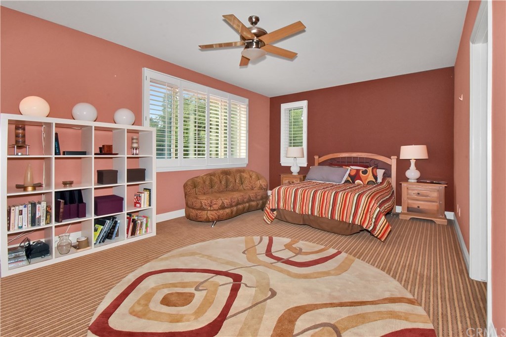 22 Hillcrest Manor Rolling Hills Estates, CA 90274 - Photo 37 of 54 a bedroom with furniture and a large window