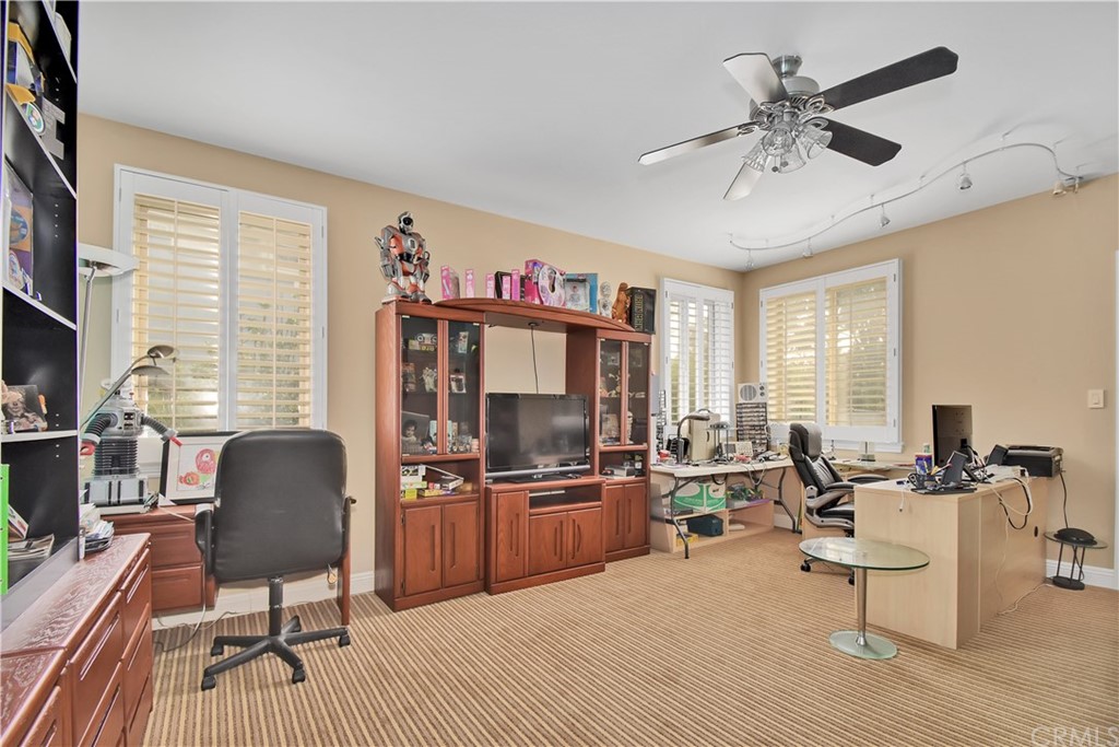 22 Hillcrest Manor Rolling Hills Estates, CA 90274 - Photo 40 of 54 a living room with furniture and a flat screen tv