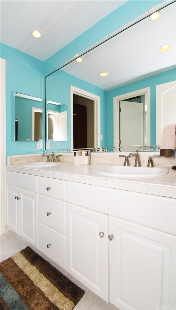 22 Hillcrest Manor Rolling Hills Estates, CA 90274 - Photo 42 of 54 a bathroom with a sink and a mirror