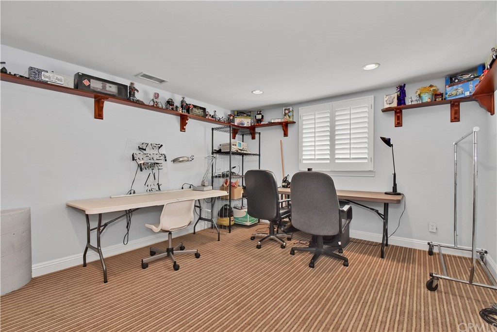 22 Hillcrest Manor Rolling Hills Estates, CA 90274 - Photo 44 of 54 a view of a workspace with furniture and lounge chair