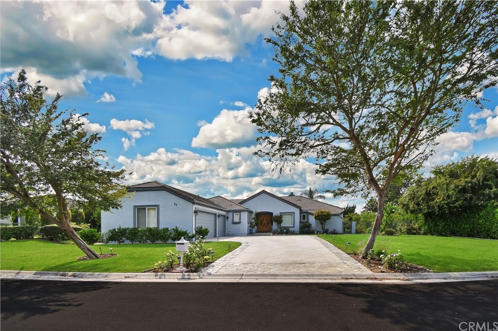 22 Hillcrest Manor Rolling Hills Estates, CA 90274 - Photo 54 of 54 a front view of a house with a yard and a garage