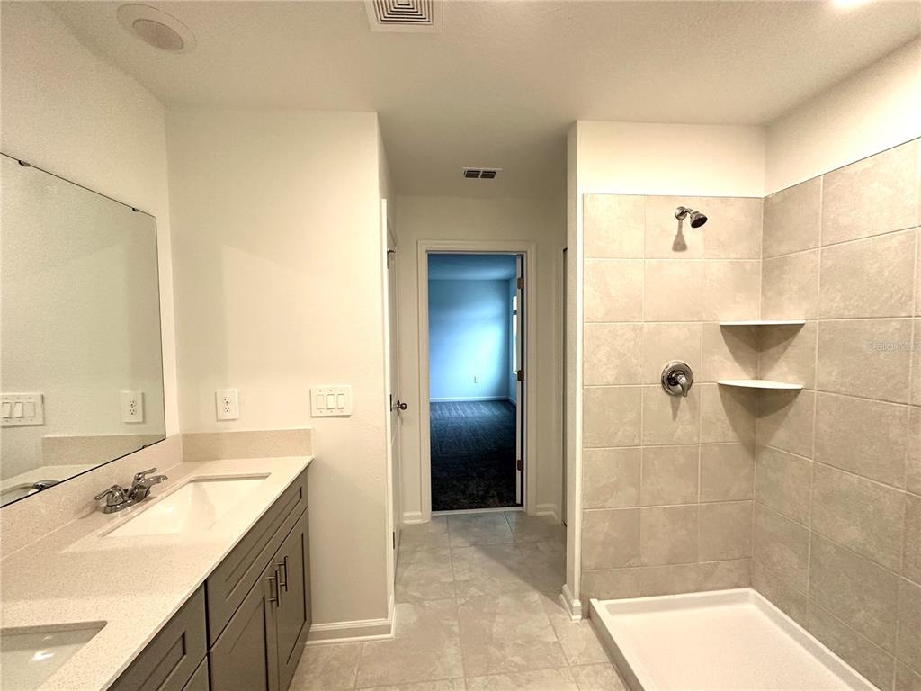 1784 Foreman Road Eagle Lake, FL 33839 - Photo 16 of 24 a bathroom with a sink and a shower