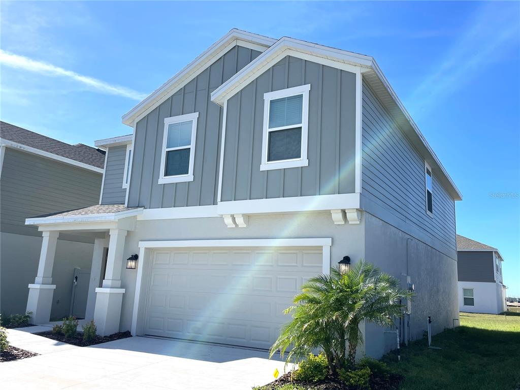 1784 Foreman Road Eagle Lake, FL 33839 - Photo 3 of 24 a front view of a house with garden