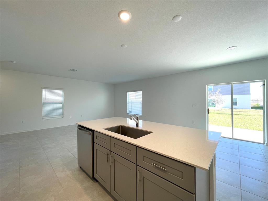 1784 Foreman Road Eagle Lake, FL 33839 - Photo 6 of 24 a kitchen with a sink and a window