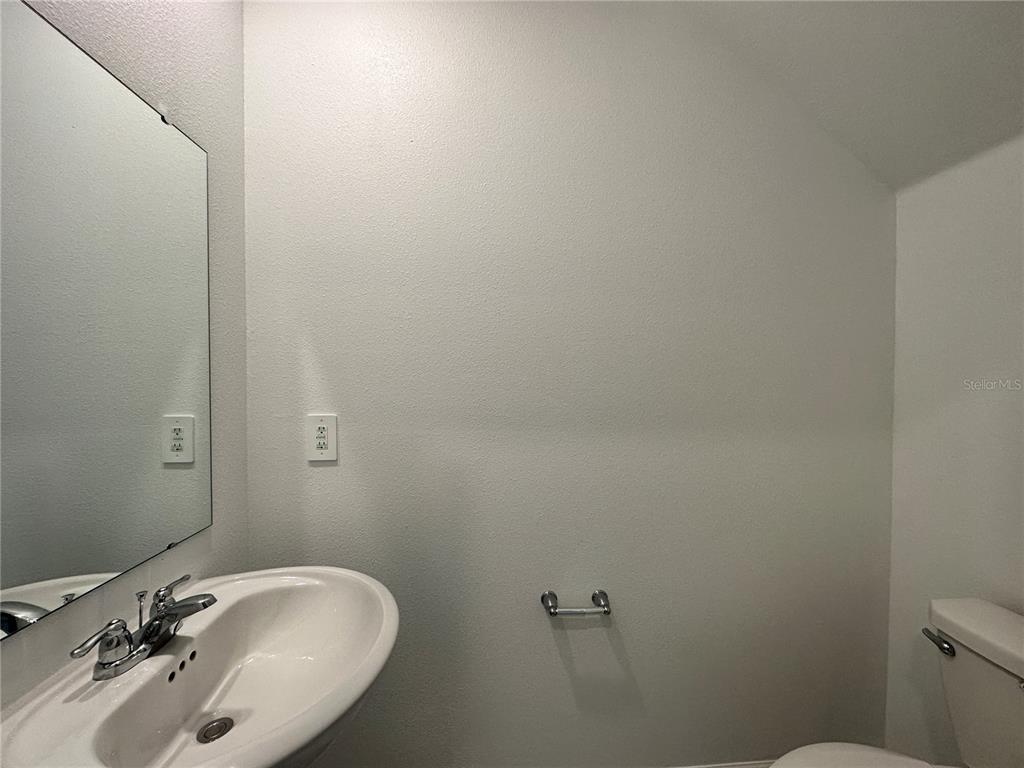 1784 Foreman Road Eagle Lake, FL 33839 - Photo 10 of 24 a bathroom with a sink and mirror