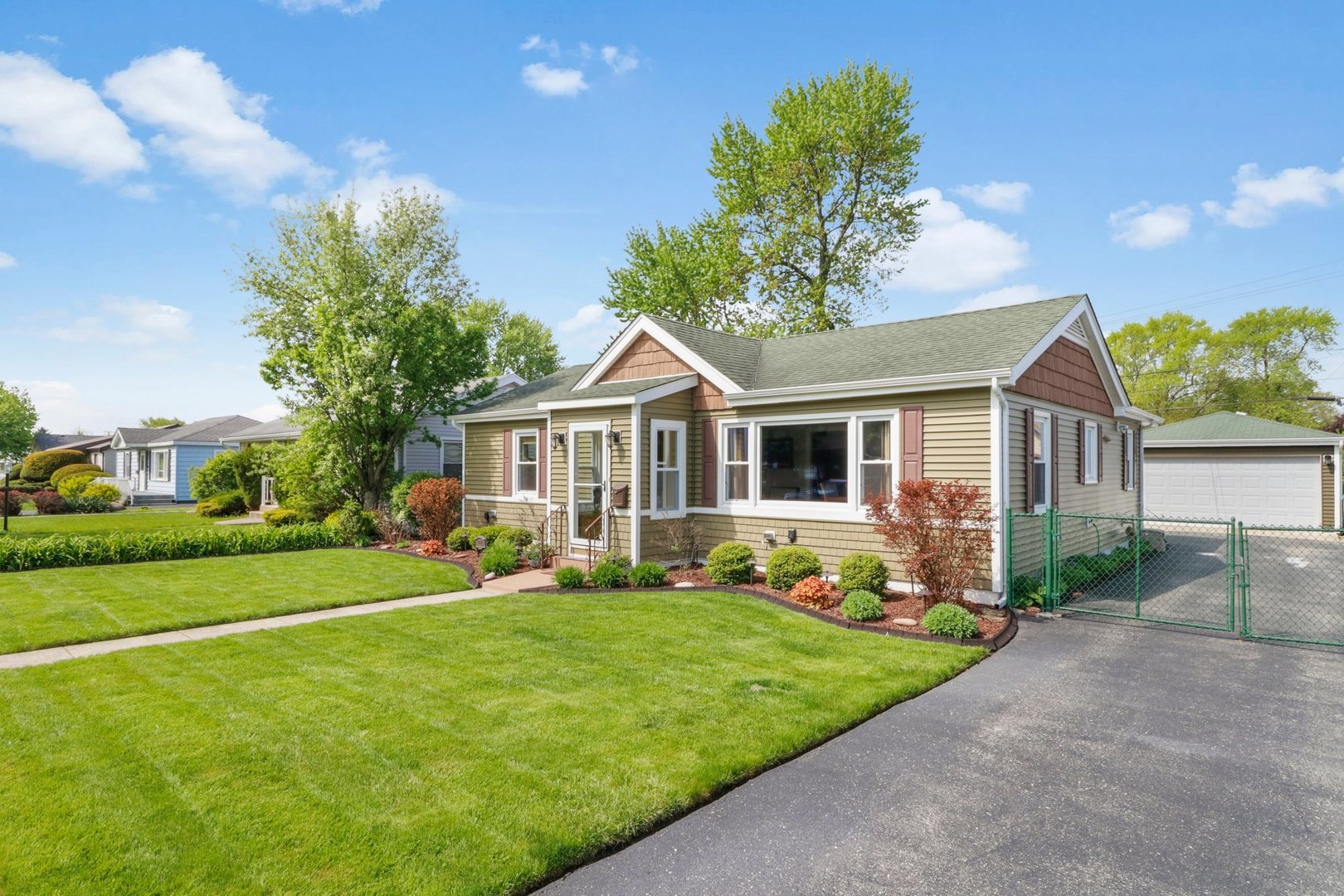 10930 Oak Avenue Chicago Ridge, IL 60415 - Photo 2 of 20 a front view of a house with a yard and trees