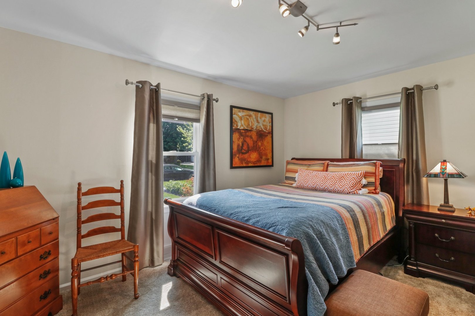 10930 Oak Avenue Chicago Ridge, IL 60415 - Photo 13 of 20 a bedroom with a bed and a dresser next to a window