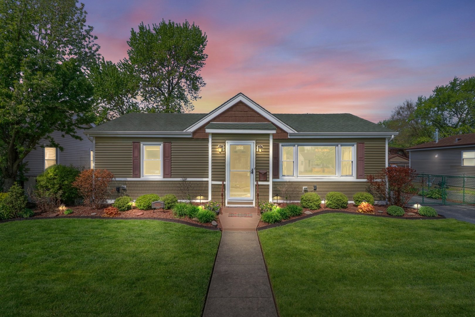 10930 Oak Avenue Chicago Ridge, IL 60415 - Photo 17 of 20 a front view of a house with a garden and plants