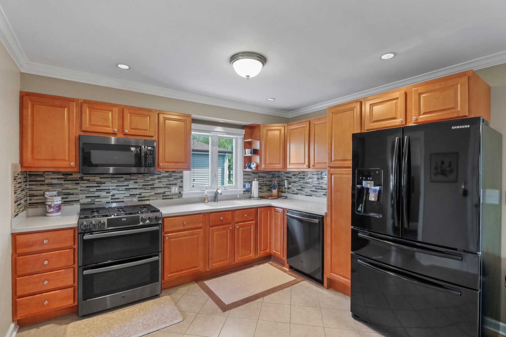 10930 Oak Avenue Chicago Ridge, IL 60415 - Photo 5 of 20 a kitchen with stainless steel appliances granite countertop a refrigerator stove and sink