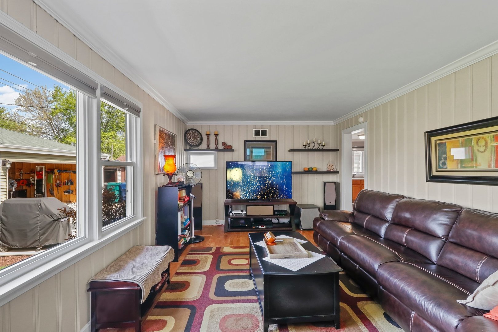 10930 Oak Avenue Chicago Ridge, IL 60415 - Photo 10 of 20 a living room with furniture a flat screen tv and a window