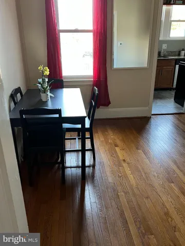 a living room with wooden floor
