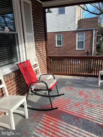 a bench sitting in front of a house