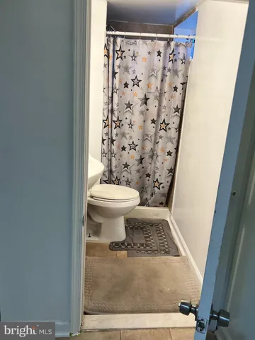 a view of staircase with white walls