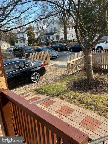 a view of a wooden deck and a yard