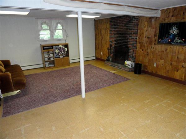 62 Old County Road Lancaster, MA 01523 - Photo 11 of 16 a view of a livingroom with wooden floor and a window