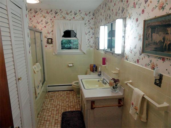 62 Old County Road Lancaster, MA 01523 - Photo 14 of 16 a bathroom with a sink and a mirror