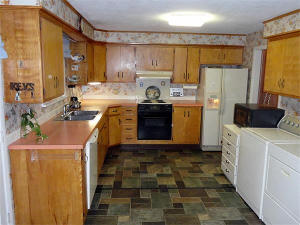 62 Old County Road Lancaster, MA 01523 - Photo 6 of 16 a kitchen with a sink stove and refrigerator