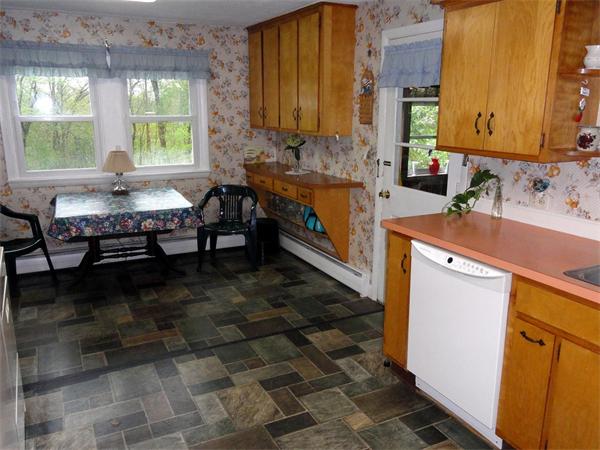 62 Old County Road Lancaster, MA 01523 - Photo 7 of 16 a kitchen with a sink and a stove top oven