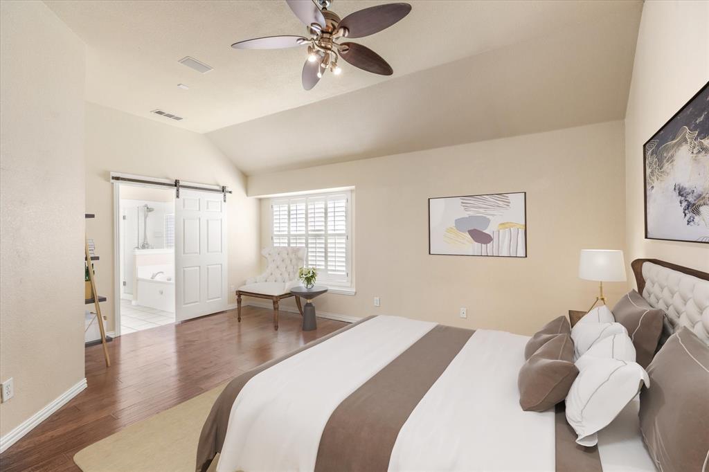 8013 Springmoss Drive Plano, TX 75025 - Photo 11 of 23 a bedroom with a bed and wooden floor