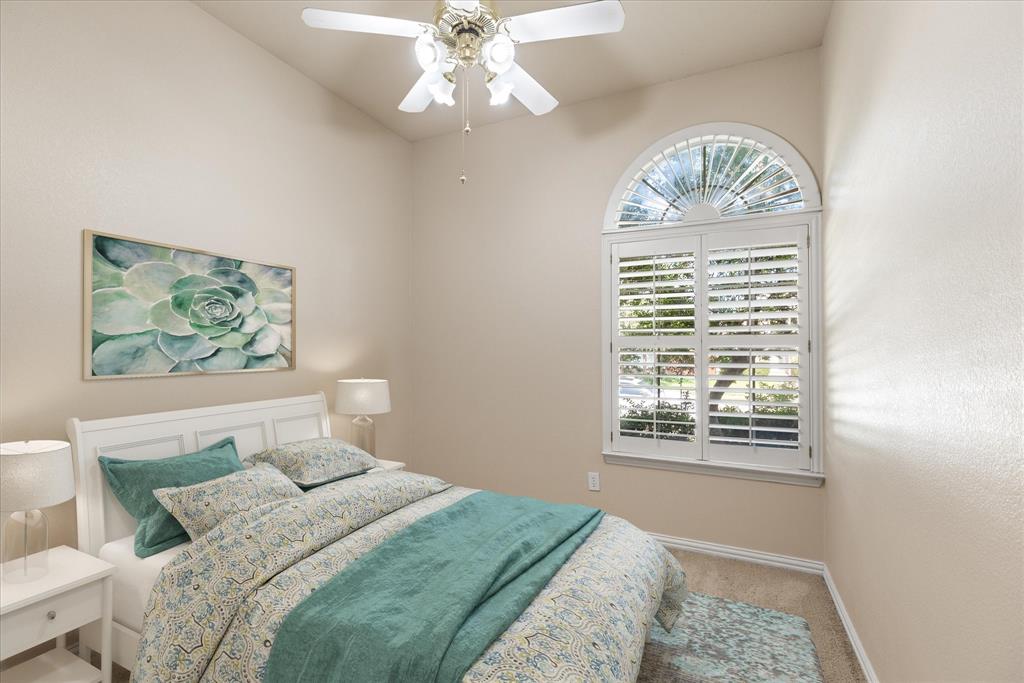 8013 Springmoss Drive Plano, TX 75025 - Photo 17 of 23 a bedroom with a large bed and a window