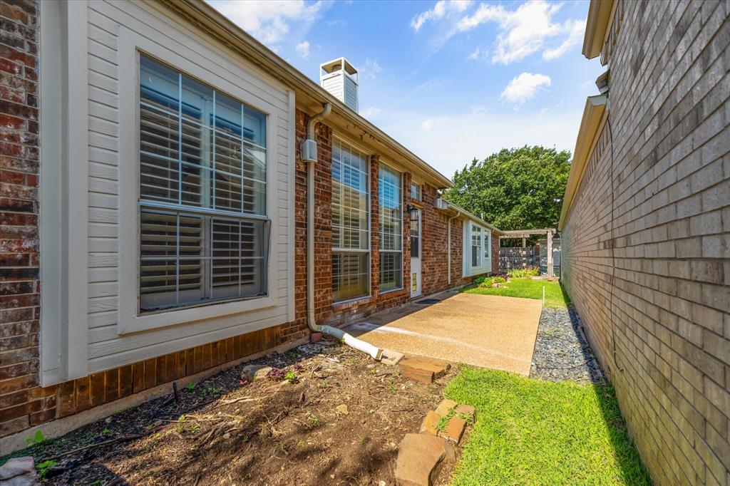 8013 Springmoss Drive Plano, TX 75025 - Photo 19 of 23 a view of a backyard with sitting area