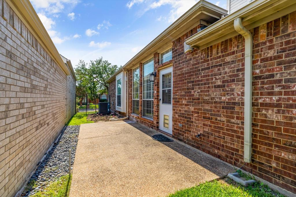 8013 Springmoss Drive Plano, TX 75025 - Photo 21 of 23 a view of a pathway with a house
