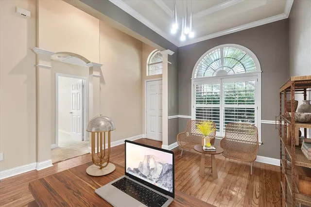 a view of living room and wooden floor