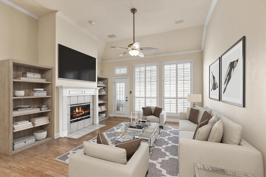 8013 Springmoss Drive Plano, TX 75025 - Photo 10 of 23 a living room with furniture a fireplace and a flat screen tv