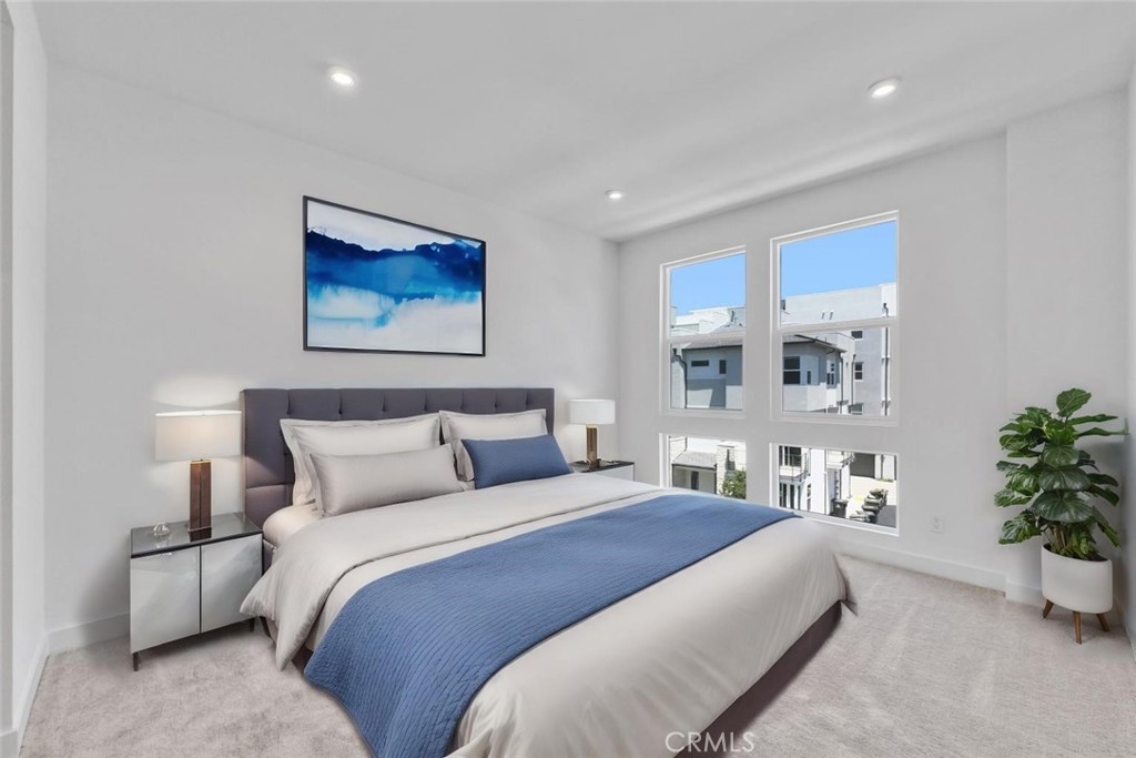 1122 West Bushell Street Anaheim, CA 92805 - Photo 15 of 17 a bedroom with bed and a potted plant