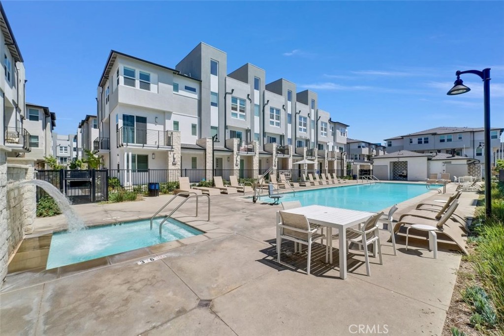 1122 West Bushell Street Anaheim, CA 92805 - Photo 17 of 17 a swimming pool with outdoor seating and yard