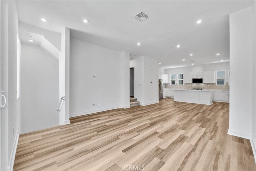 1122 West Bushell Street Anaheim, CA 92805 - Photo 5 of 17 a view of an empty room and kitchen view
