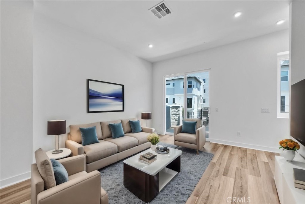 1122 West Bushell Street Anaheim, CA 92805 - Photo 6 of 17 a living room with furniture and a couch