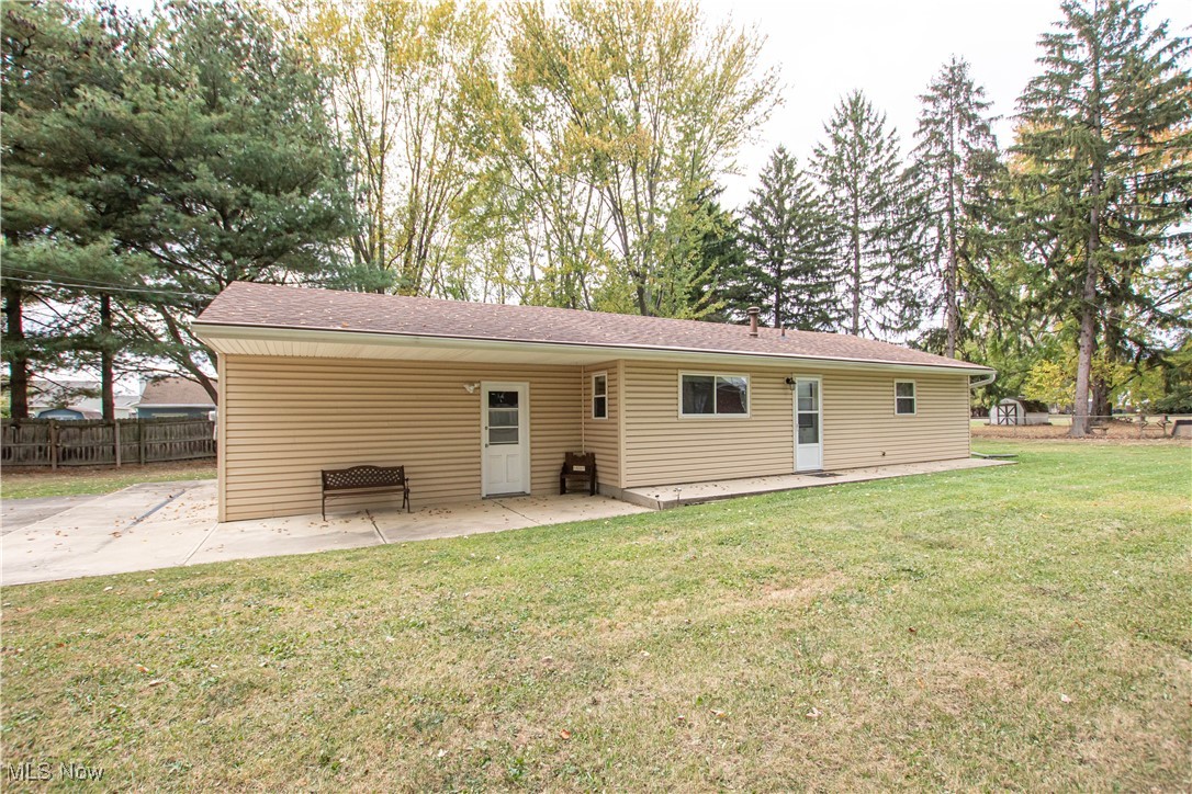 706 Abbe Road South Elyria, OH 44035 - Photo 31 of 34 Back of property with a patio area and roof with shingles