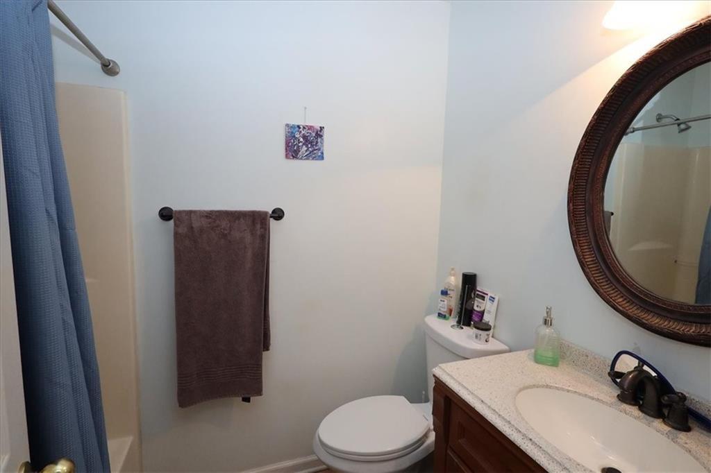 236 Hiram Sudie Road Dallas, GA 30157 - Photo 15 of 26 a bathroom with a sink and a mirror