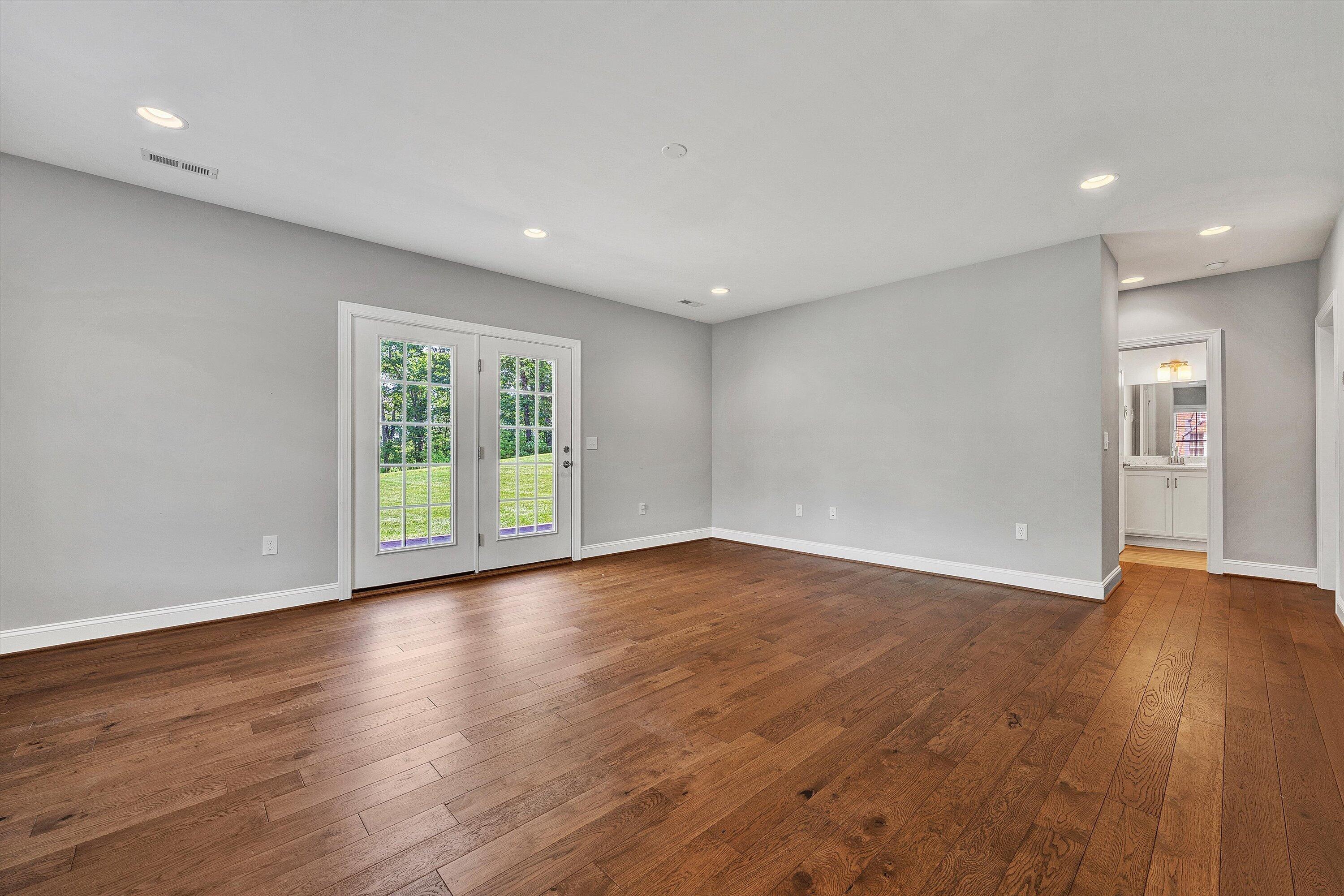 6981 Fairway Ridge Road Salem, VA 24153 - Photo 41 of 53 a view of an empty room with wooden floor and a window