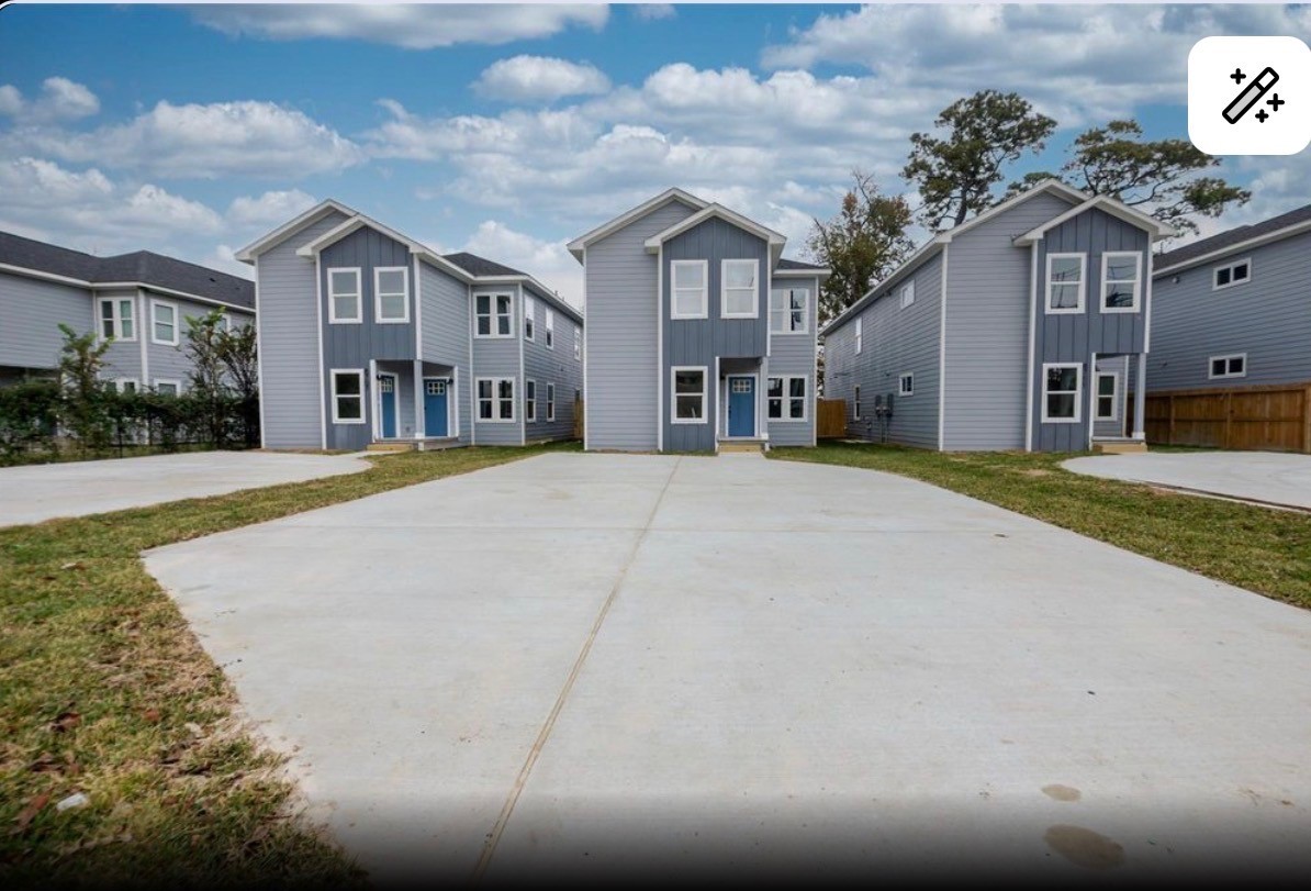 a view of a building with a street