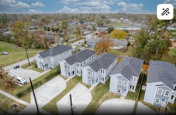 an aerial view of a house with a swimming pool