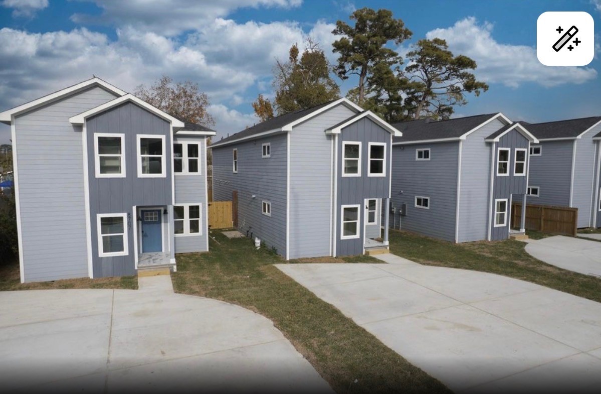8713 Westcott Road, Unit B Houston, TX 77016 - Photo 3 of 14 a front view of a house with a yard and garage