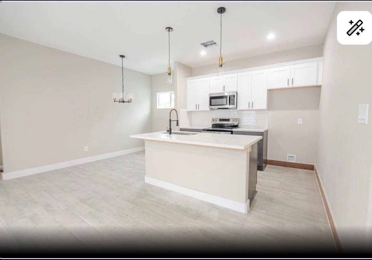 8713 Westcott Road, Unit B Houston, TX 77016 - Photo 4 of 14 a kitchen with stainless steel appliances granite countertop a sink a stove and a refrigerator