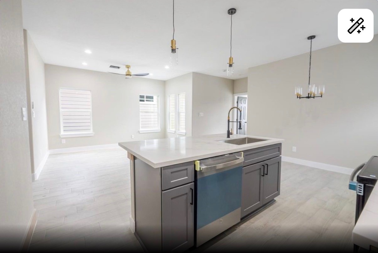 8713 Westcott Road, Unit B Houston, TX 77016 - Photo 6 of 14 a kitchen with stainless steel appliances granite countertop a sink a stove and a wooden floor