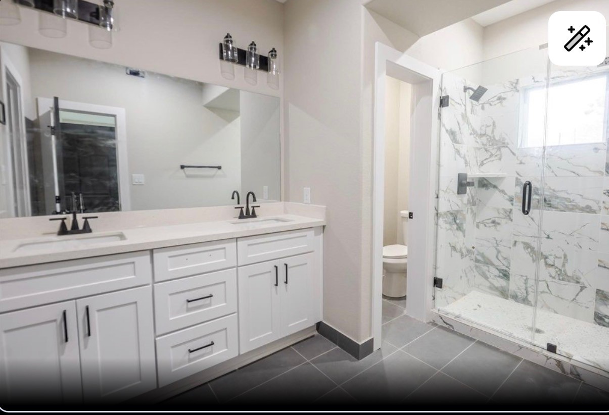 8713 Westcott Road, Unit B Houston, TX 77016 - Photo 8 of 14 a bathroom with a double vanity sink mirror and shower