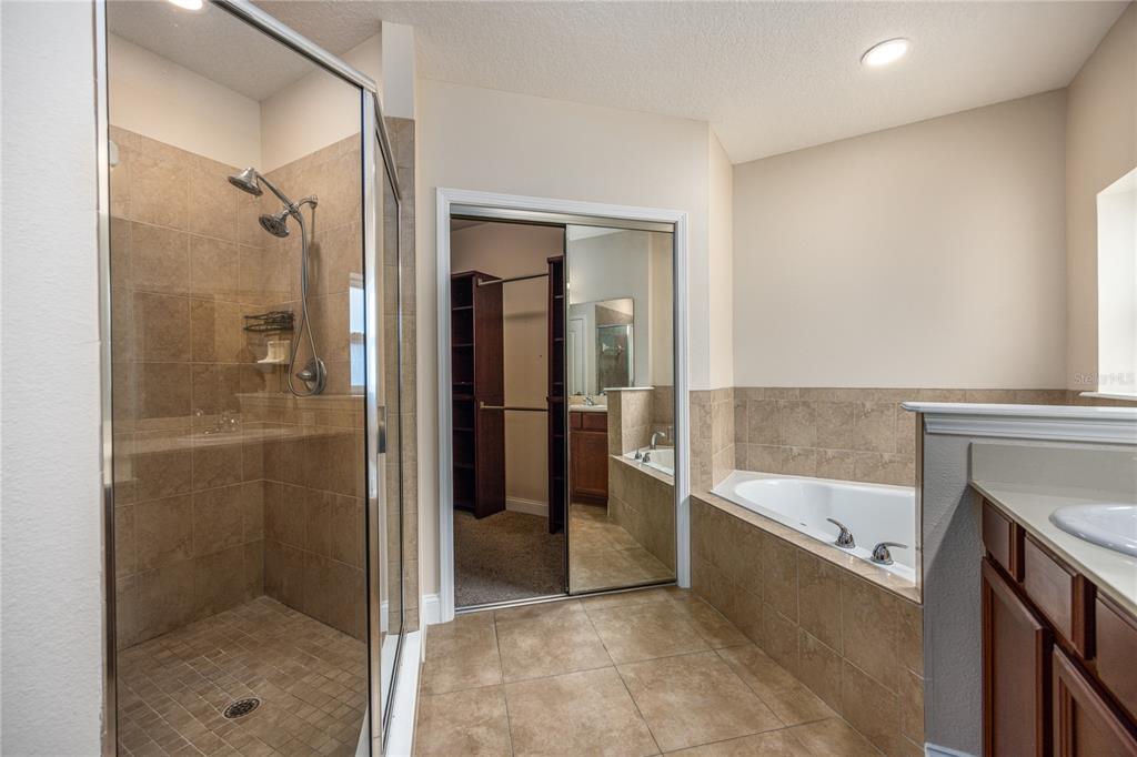8216 Northwest 54th Street Gainesville, FL 32653 - Photo 38 of 58 a bathroom with a tub and shower
