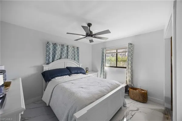 a bathroom with a sink toilet a mirror and shower